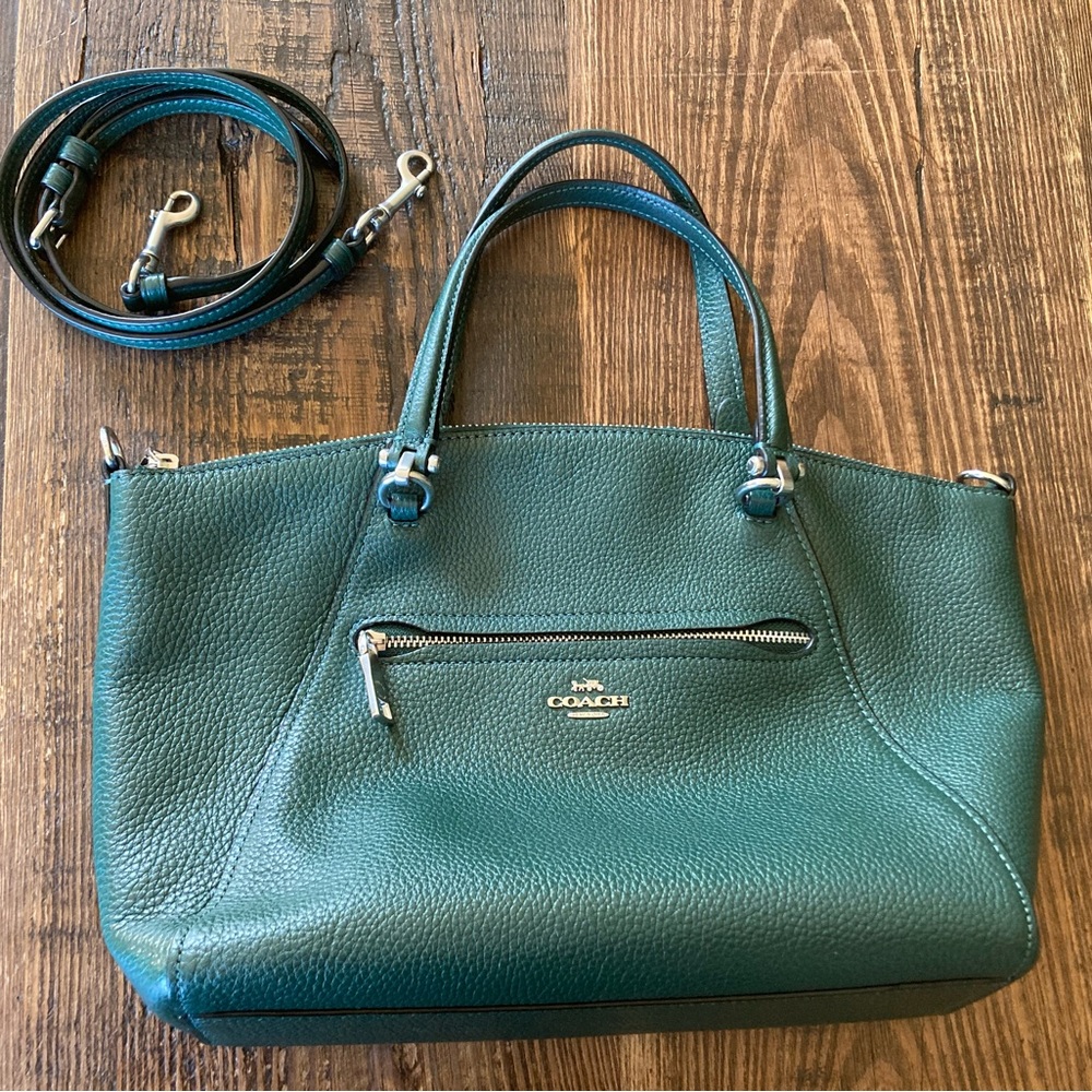 Coach rich green pebbled leather two-handle satchel with crossbody strap.